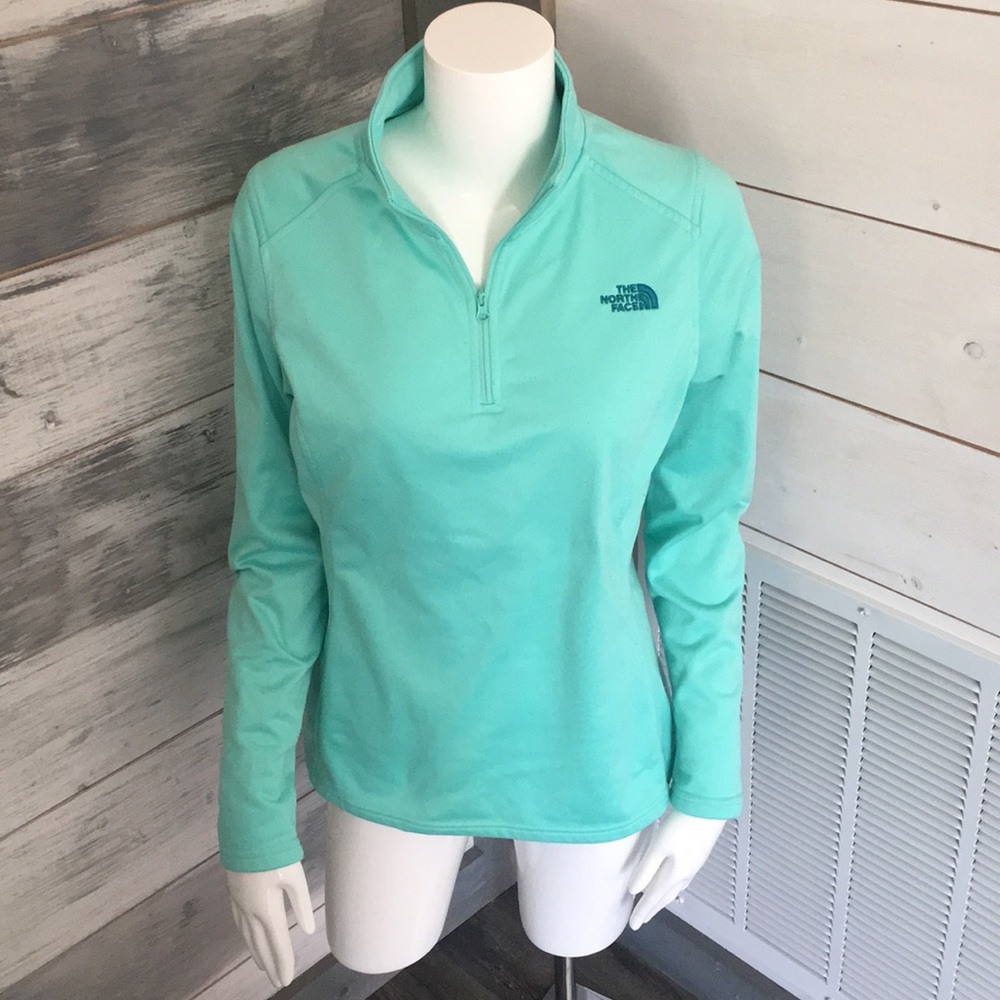 The North Face pullover jacket in mint color.